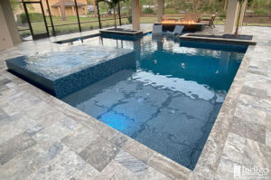 pool with medium blue water and large square water feature
