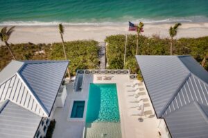 aerial view of U-shaped home with pool and spa in Boca Grande, FL